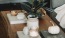 lifestyle image of some decor on a wooden table